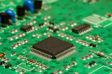 smd printed electronic circuit board with micro controller and components, shallow dof
