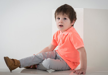 Little stylish fashion model - boy on white backgrpund in modern clothes