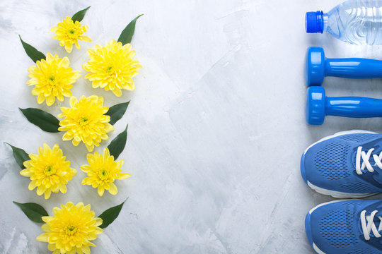 Summer Flatlay Composition With Sport Equipment And Flowers.