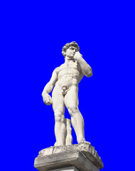 Fototapeta premium The statue of a greek athlete, isolated over a uniform blue background. 