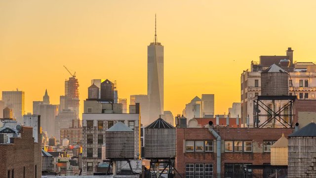 USA, New York, Manhattan, Midtown, Freedom Tower over rooftops and water towers TIMELAPSE Day to Night