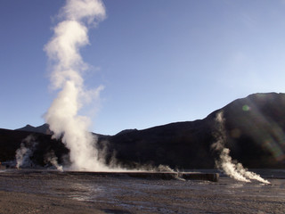 Fototapeta na wymiar geyser gush hot spring steam El Tatio Chile