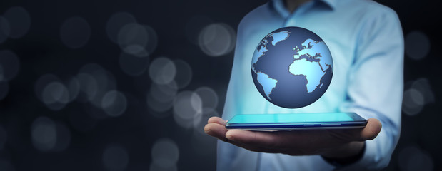 businessman hand phone with globe in screen