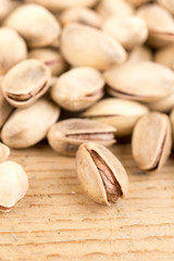 Pile of roasted pistachio on the wooden table