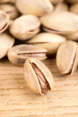 Pile of roasted pistachio on the wooden table