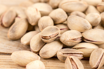 Pile of roasted pistachio on the wooden table