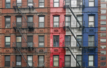 Manhattan, old apartment buildings with external fire escape ladders