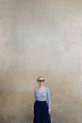 Portrait of a woman against the blank wall. Copy space for your text.
