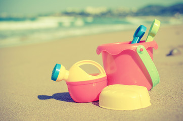 Fototapeta na wymiar Children's beach toys on the sand