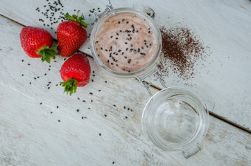Homemade yogurt in a jar with strawberry
