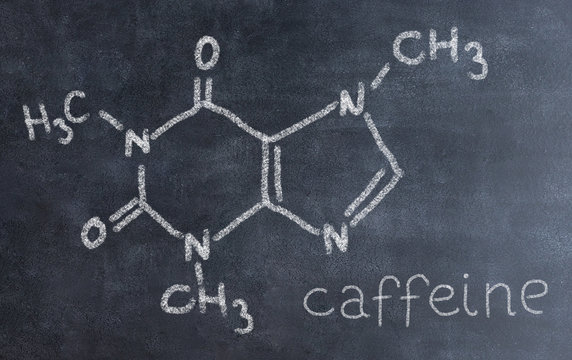 Chemical molecule structure on blackboard. Science teacher or chemistry student drawing chemical formula on blackboard in class..Nicotine, carnitine, testosterone, caffeine forumula.