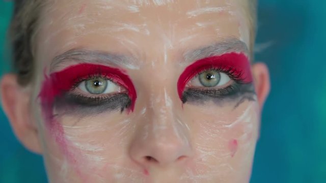 Close up shot of teen girl's eyes with creative unusual makeup. Beauty, fashion and make up concept