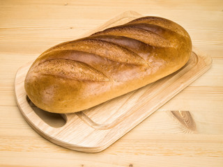 Long loaf of white, cut bread