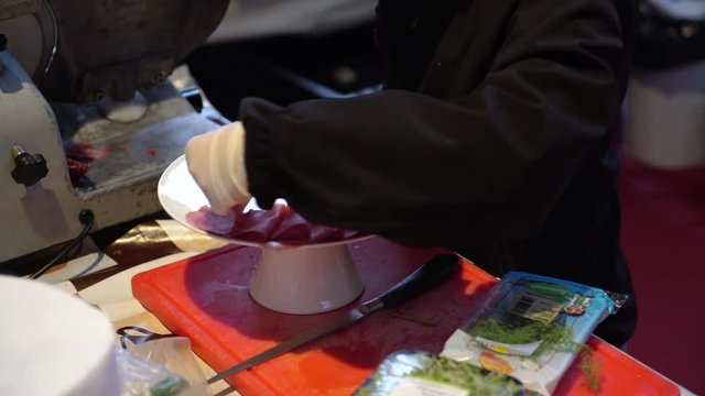 A cook preparing a dish of bresaola for a wedding catering, 4K