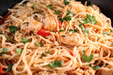 Delicious chicken spaghetti with vegetables, closeup