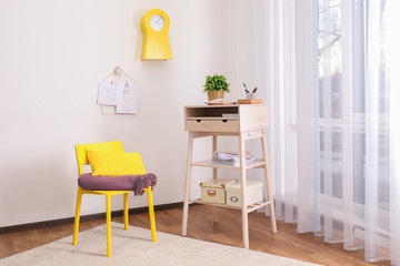 High wooden table as stand up work place in modern interior