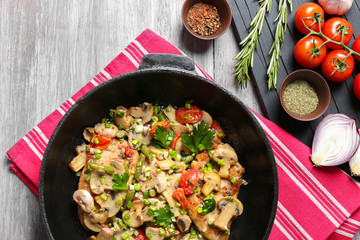 Tasty chicken marsala on pan on table