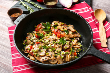 Tasty chicken marsala on pan on table