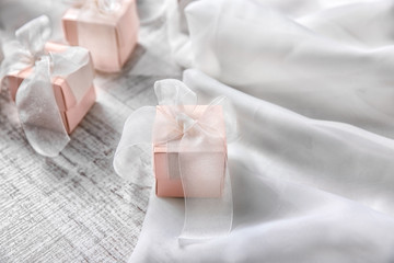 Fototapeta na wymiar Little gift boxes for wedding day on table
