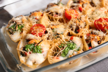 Glass baking dish with stuffed pasta, closeup