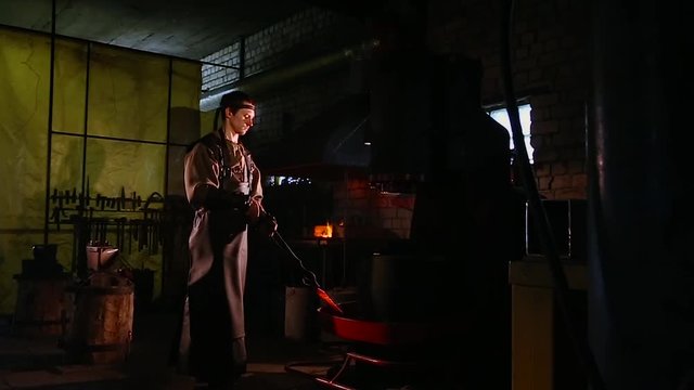 Red hot iron lingot on a press machine