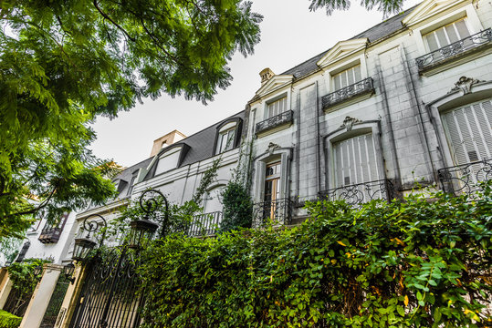Traditional classic old architecture houses and green trees in Palermo Chico neighborhood, Buenos Aires, Argentina