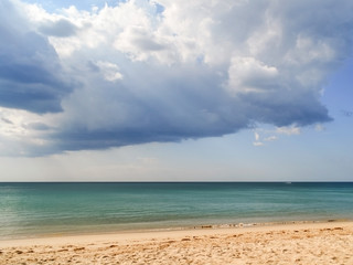 Storm clouds approaching from the roller tropical beach