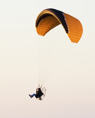 A motorized chute glides above the beach at Fort Desoto Park near St. Pete Beach Florida.