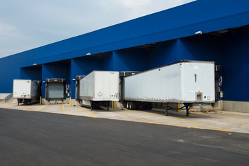 Fototapeta premium Transportation service delivery station. Big distribution warehouse with gates for loads and trucks.