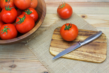 Closeup Fresh ripe tomatoes on wood background