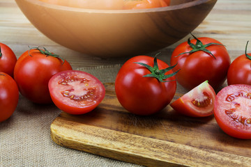 Closeup Fresh ripe tomatoes on wood background