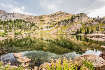 Closeup of Cecret lake with mountains in Albion Basin, Utah