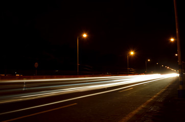 Long exposure, traffic in night running through road