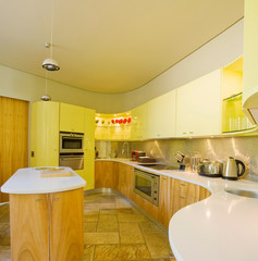 Kitchen in comtemporary home with large eating area. Kitchen, dining and living room of apartment 