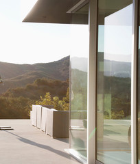 External view of a contemporary house with pool at dusk