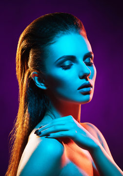 Portrait of a beautiful, seductive and young girl. Mixed and fashionable lightning effect.