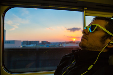 Man on train at sunset