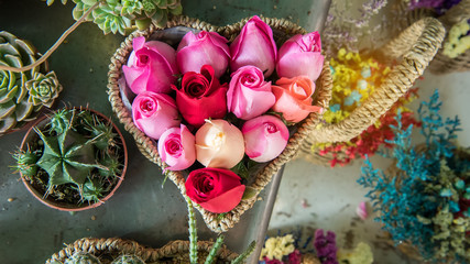 Roses bouquet in heart shape basket