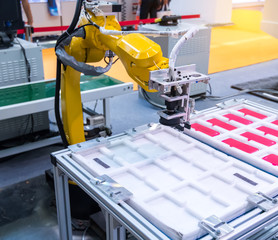 Fototapeta premium Robotic arm at production line in factory