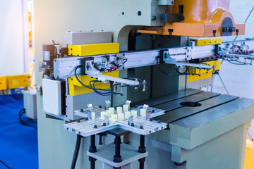 Robotic arm at production line in factory