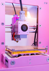3D printer on a pink background