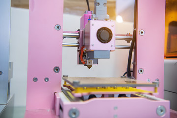3D printer on a pink background