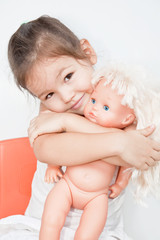 Little girl with a doll 