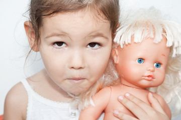 Little girl with a doll 