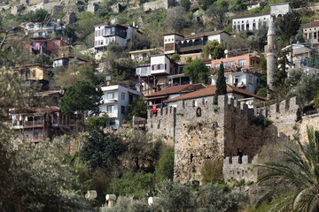 Fototapeta na wymiar Medieval castle wall with old houses behind wall