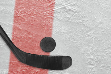 Hockey stick and washer on ice