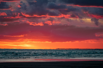 Fototapeta na wymiar Red cloudy sunset sky over the Baltic sea