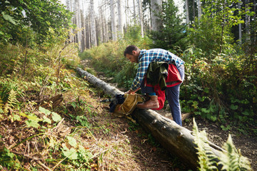 Young man preparing for a trek in the forest