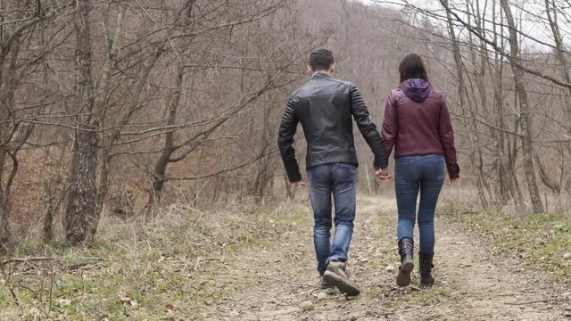 Teenagers couple walking outdoors
