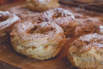Freshly baked delicious profiteroles covered with roasted almonds. 